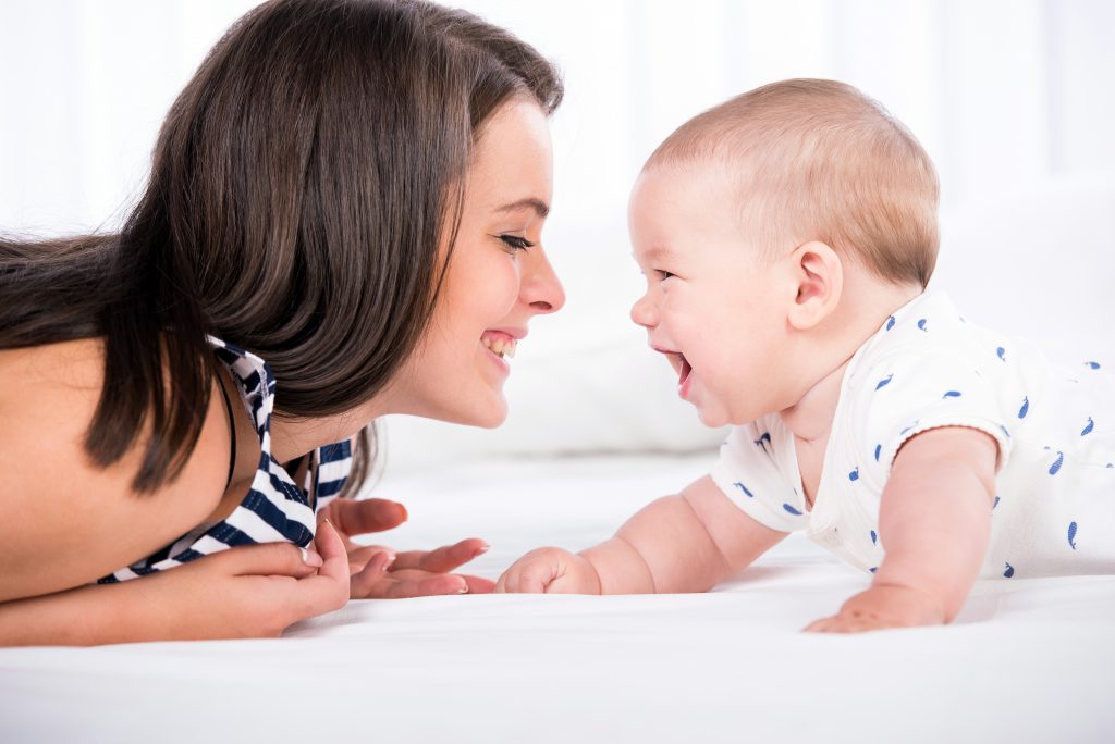 Mom and baby smiling at each other