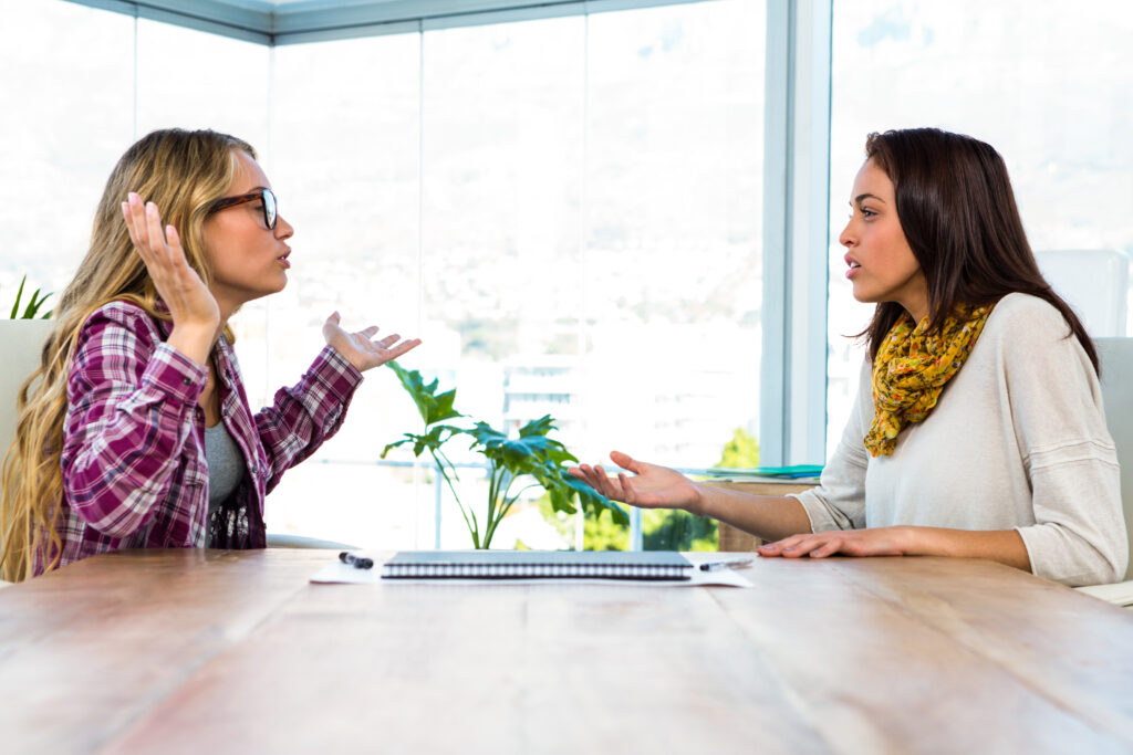 Two women talking in an office