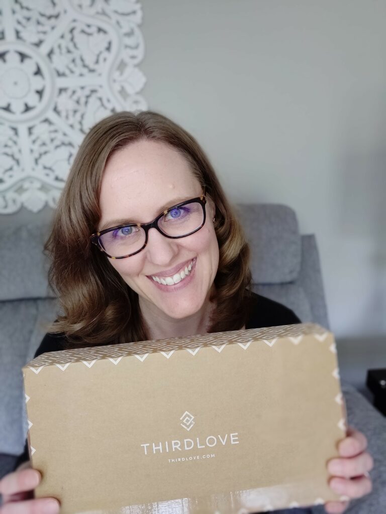 Woman holding ThirdLove bra box