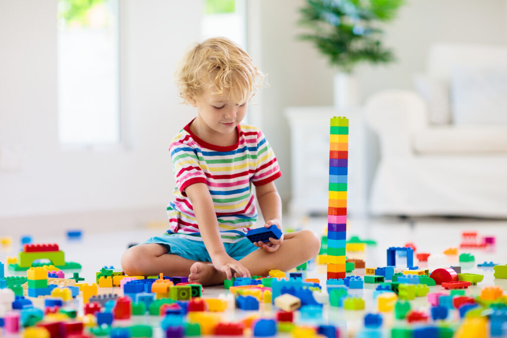 4 year old boy playing with Legos