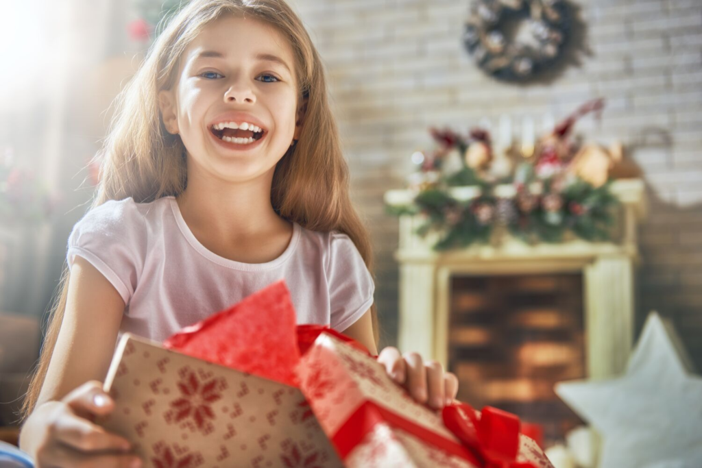 Happy girl with Christmas Gift