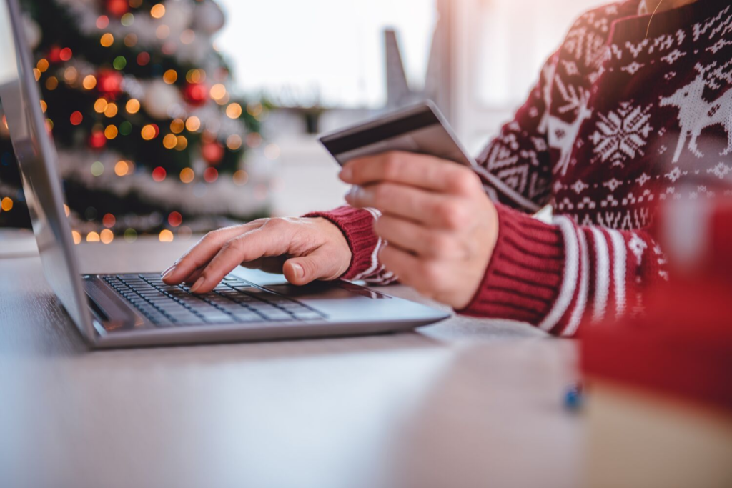 Woman shopping online for Christmas gifts